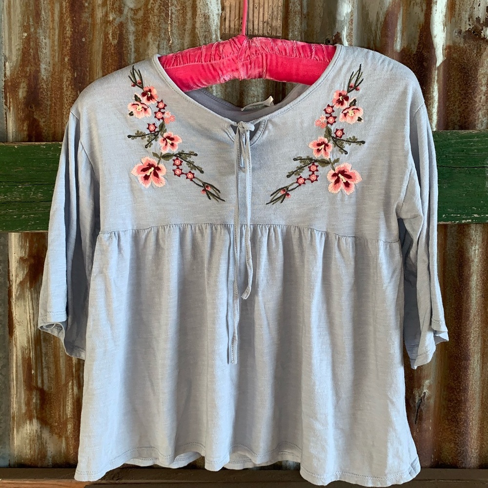 blue 3 quarter length sleeve with floral design